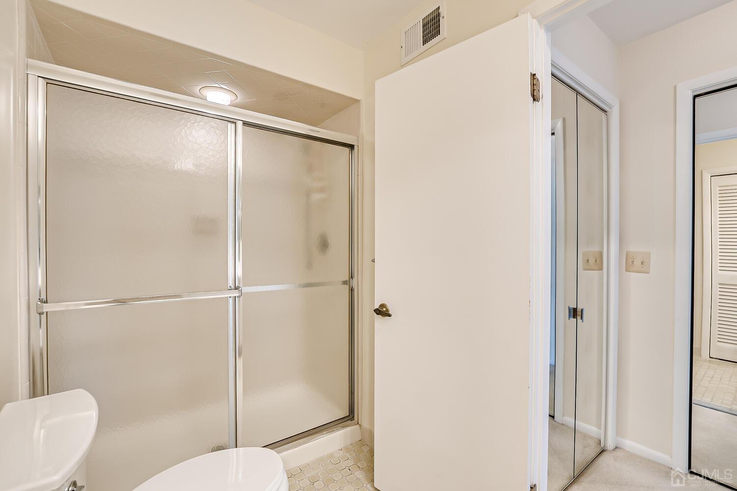 96 Heather Court Edison, NJ 08820 - Photo 29 of 37 a bathroom with a glass shower door