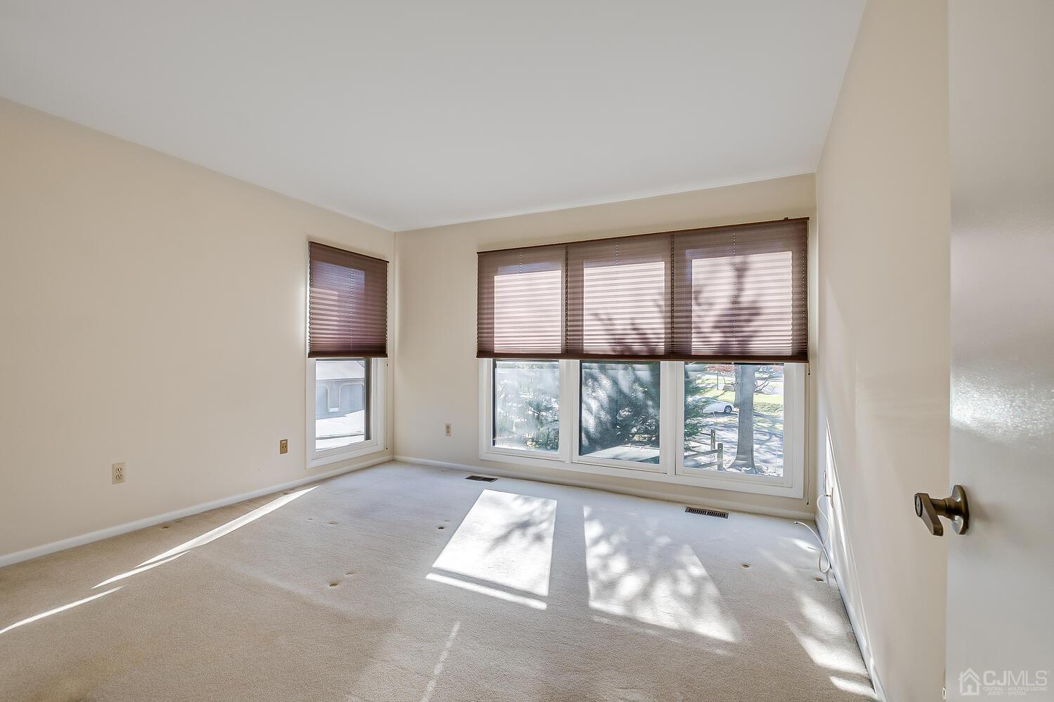 96 Heather Court Edison, NJ 08820 - Photo 30 of 37 wooden floor in an empty room with a window
