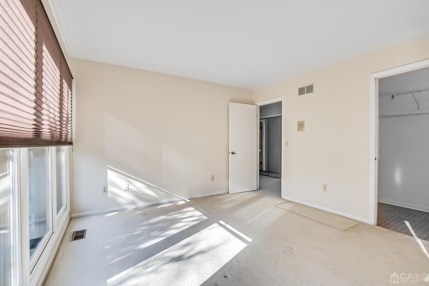 96 Heather Court Edison, NJ 08820 - Photo 31 of 37 a view of a big room with closet and windows