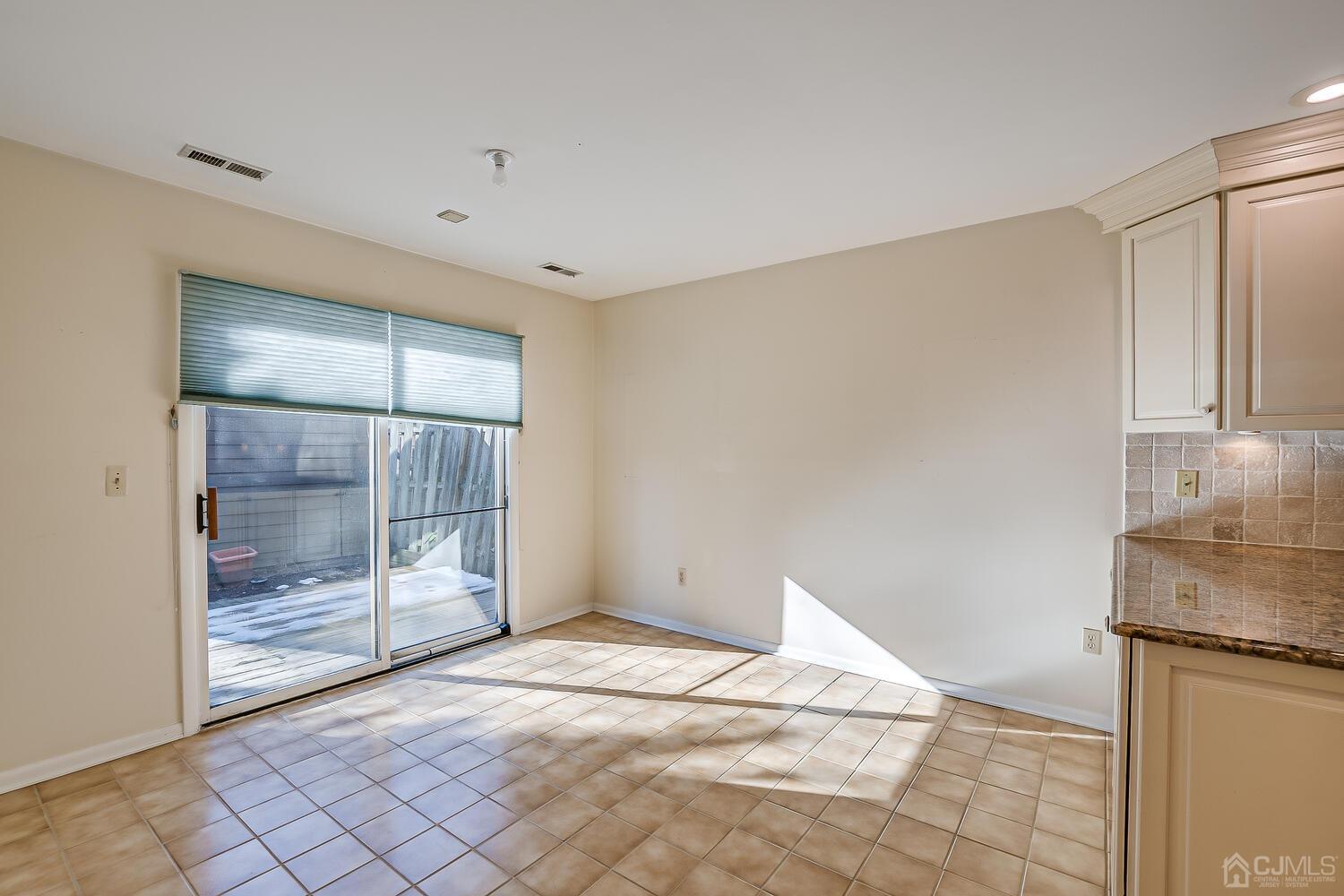 96 Heather Court Edison, NJ 08820 - Photo 10 of 37 a view of a room with wooden floor and cabinet