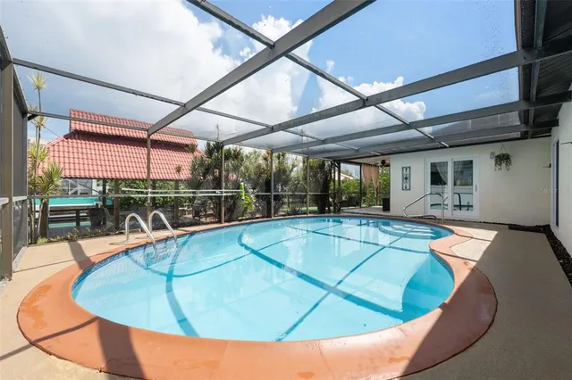 a view of a swimming pool with a patio
