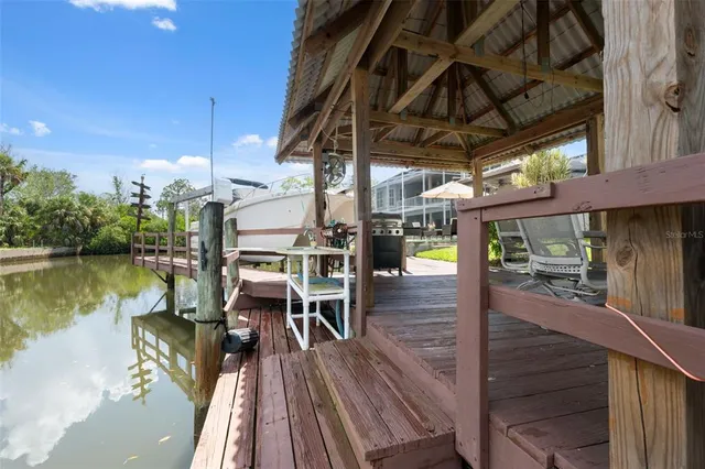 a view of a swimming pool with outdoor seating