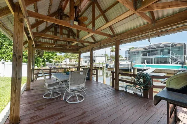 a view of a patio with table and chairs