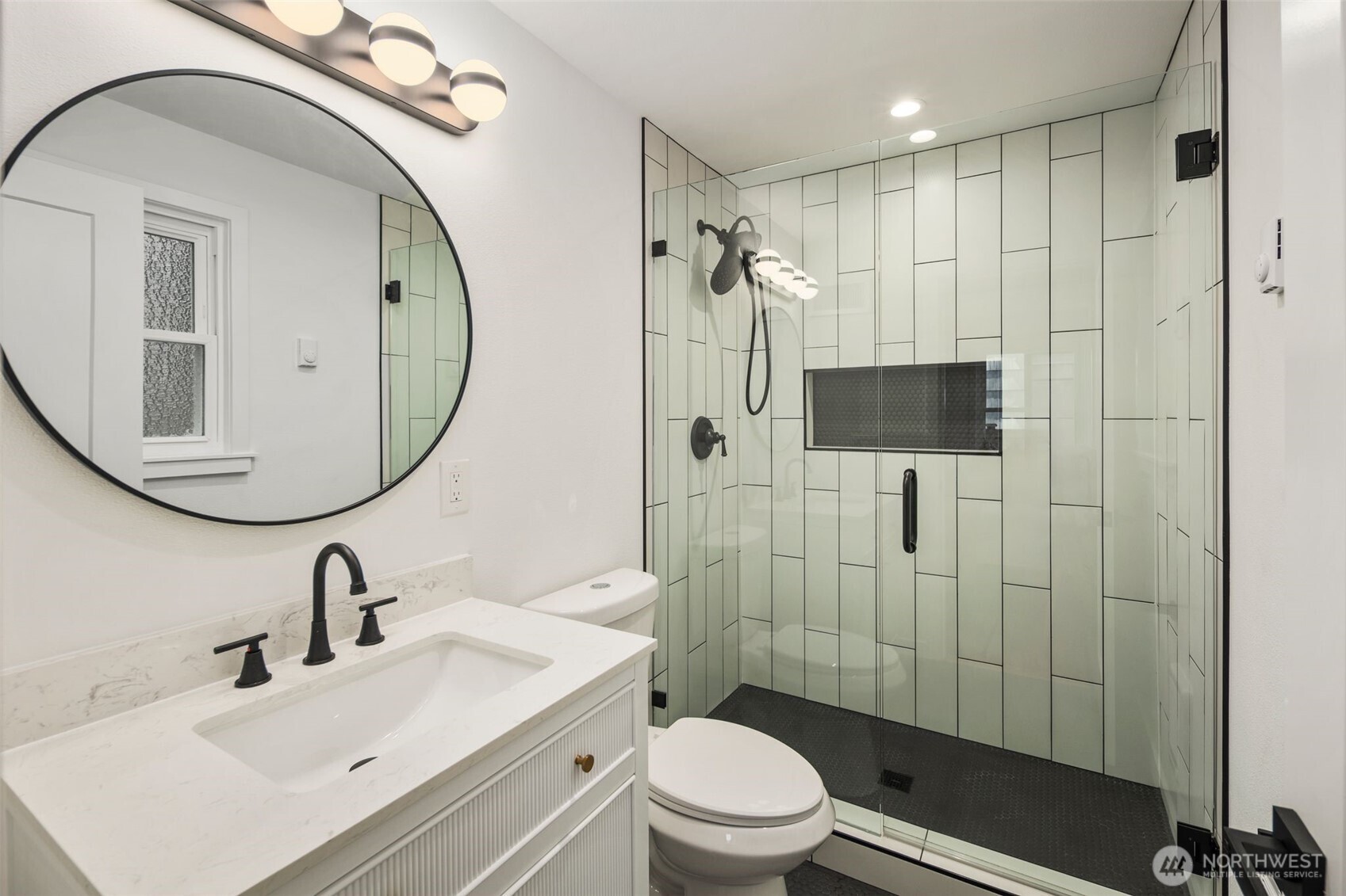 3811 Northeast 89th Street Seattle, WA 98115 - Photo 26 of 32 a bathroom with a sink toilet and shower