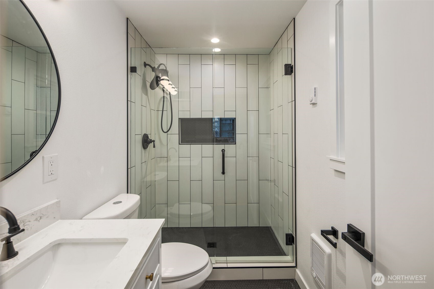 3811 Northeast 89th Street Seattle, WA 98115 - Photo 27 of 32 a bathroom with a sink a toilet and shower