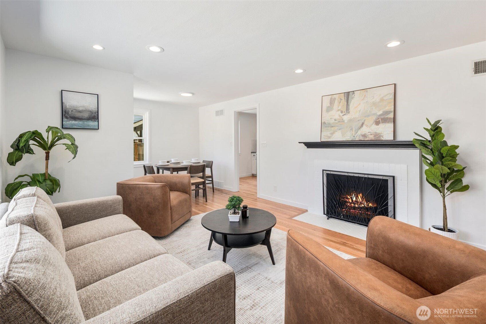 3811 Northeast 89th Street Seattle, WA 98115 - Photo 6 of 32 a living room with furniture a fireplace and a potted plant