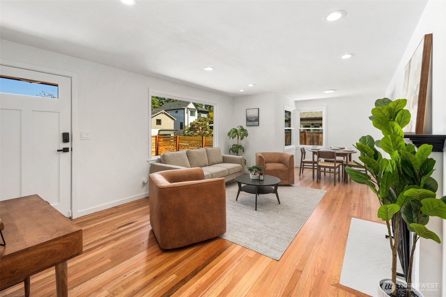3811 Northeast 89th Street Seattle, WA 98115 - Photo 9 of 32 a living room with furniture a potted plant and a large window
