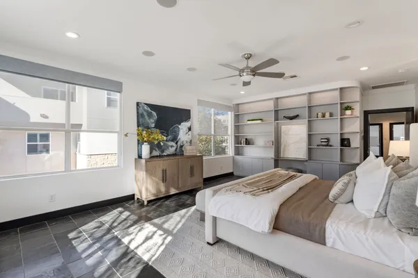 a bedroom with a large bed and a window