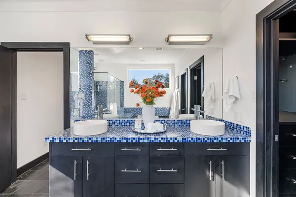 a bathroom with a granite countertop kitchen island a sink a stove and a dining table