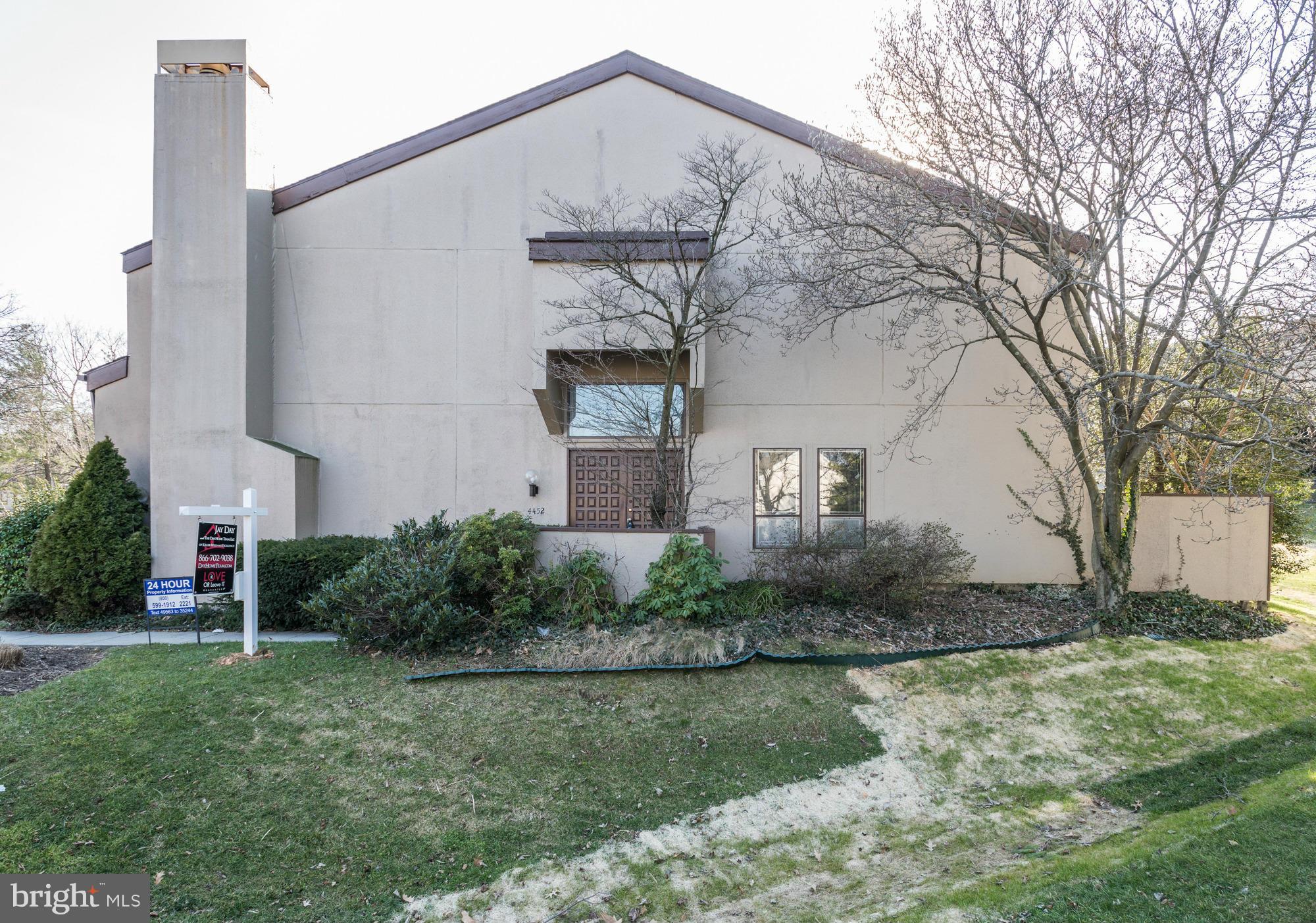 4452 Roland Springs Drive Baltimore, MD 21210 - Photo 2 of 29 a front view of a house with garden