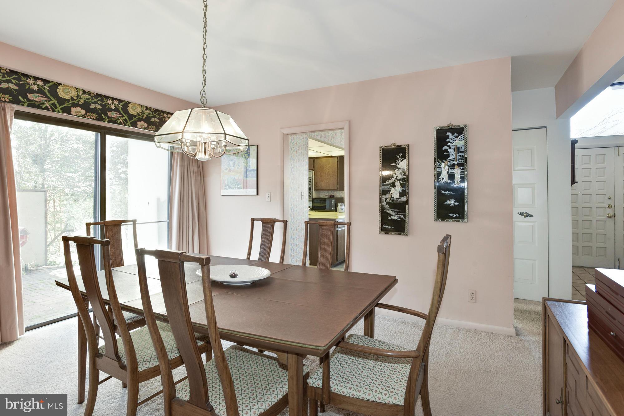 4452 Roland Springs Drive Baltimore, MD 21210 - Photo 15 of 29 a view of a dining room with furniture window and outside view