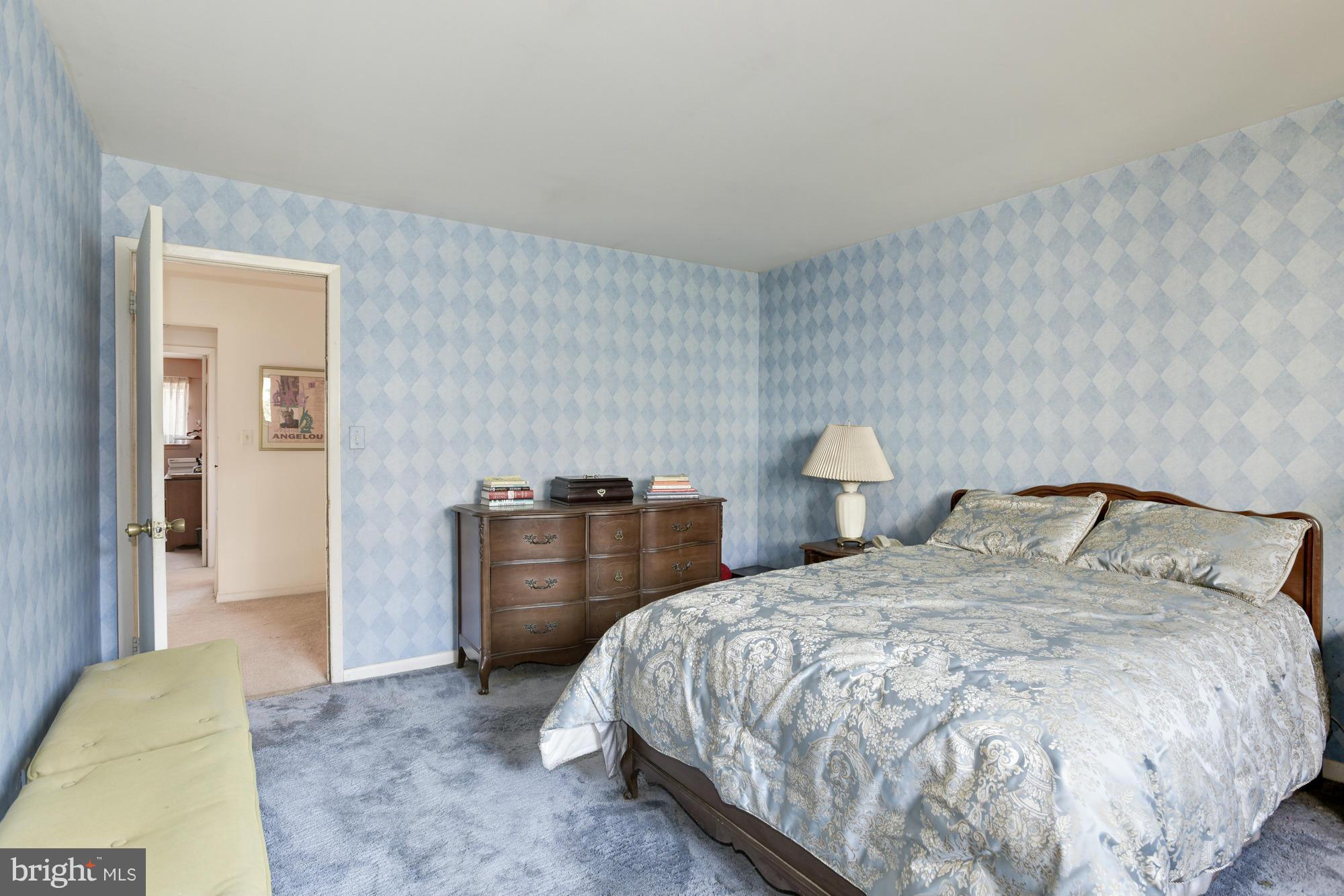 4452 Roland Springs Drive Baltimore, MD 21210 - Photo 17 of 29 a bedroom with a bed and window