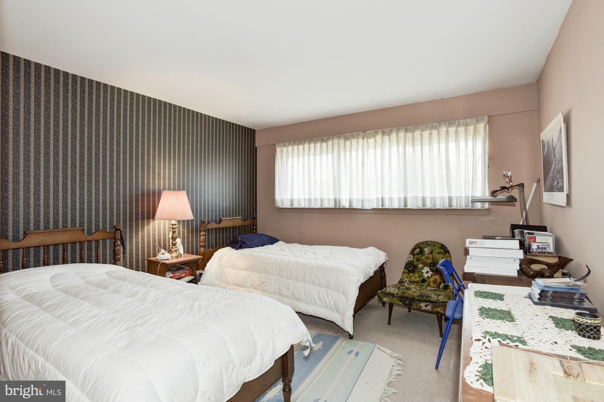4452 Roland Springs Drive Baltimore, MD 21210 - Photo 22 of 29 a bedroom with two bed and a dresser