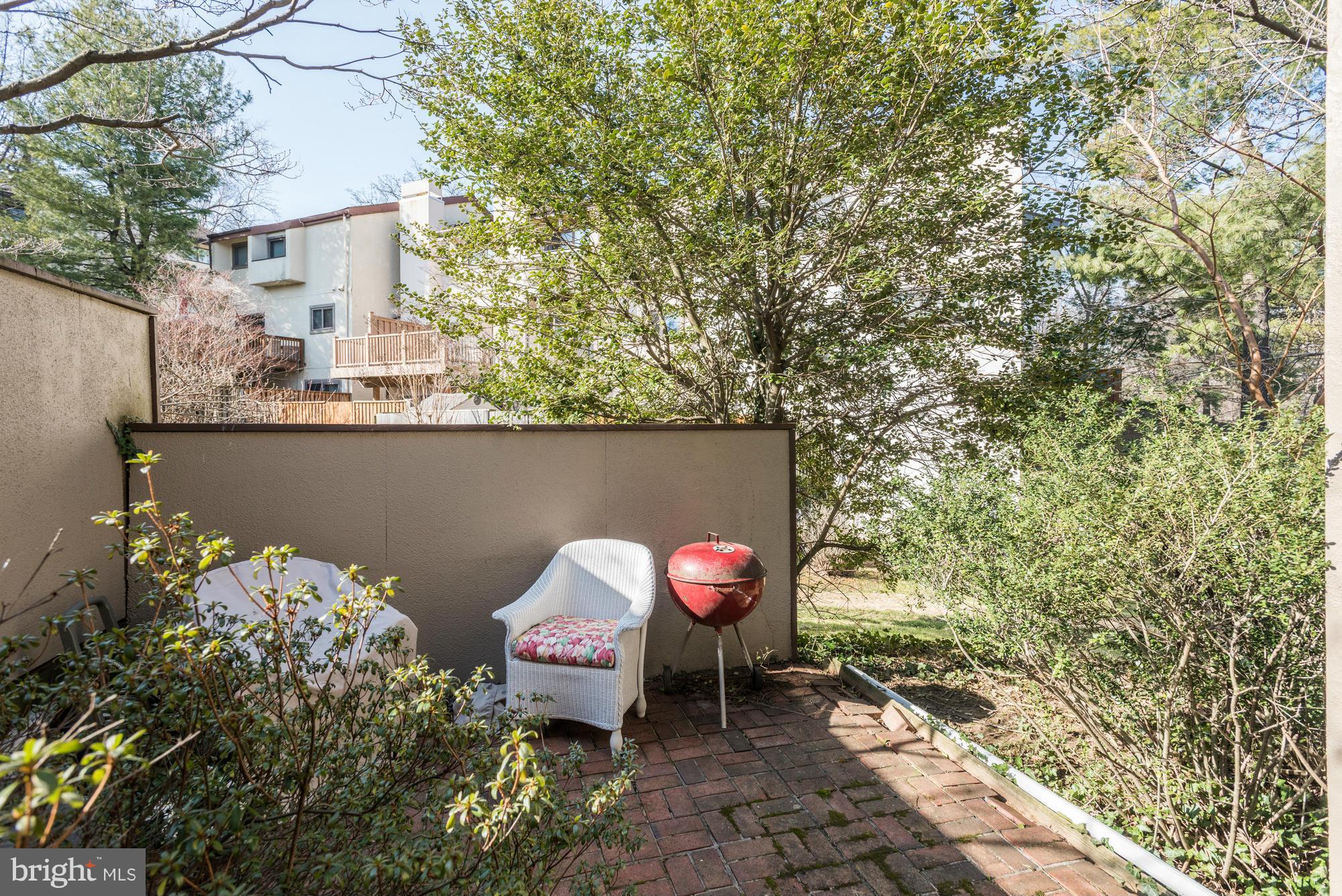 4452 Roland Springs Drive Baltimore, MD 21210 - Photo 26 of 29 a backyard of a house with table and chairs