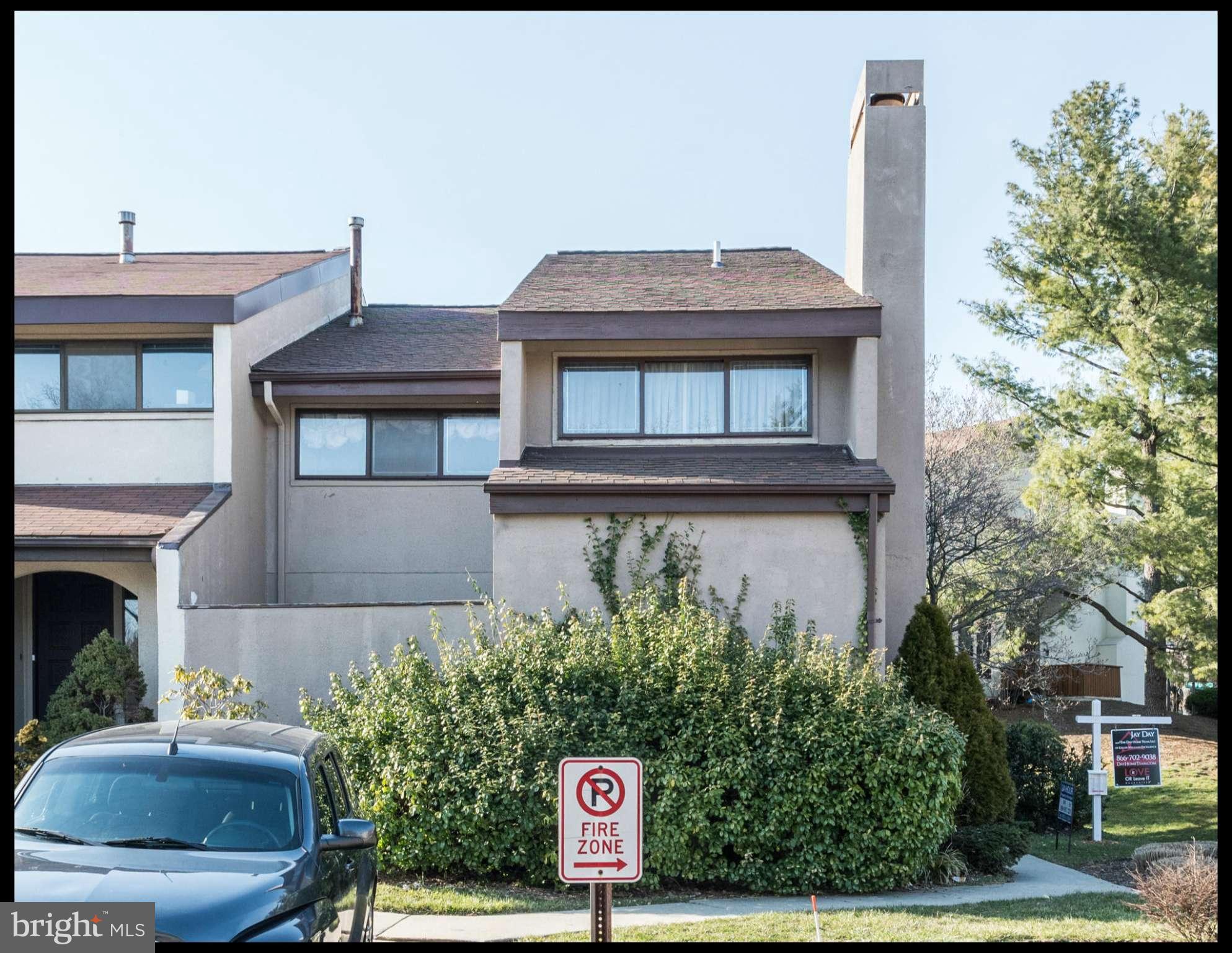 4452 Roland Springs Drive Baltimore, MD 21210 - Photo 29 of 29 a front view of a house with garden