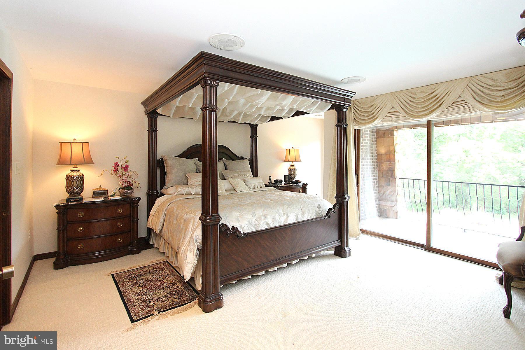 8823 Brook Road McLean, VA 22102 - Photo 20 of 30 a bedroom with a bed and large window
