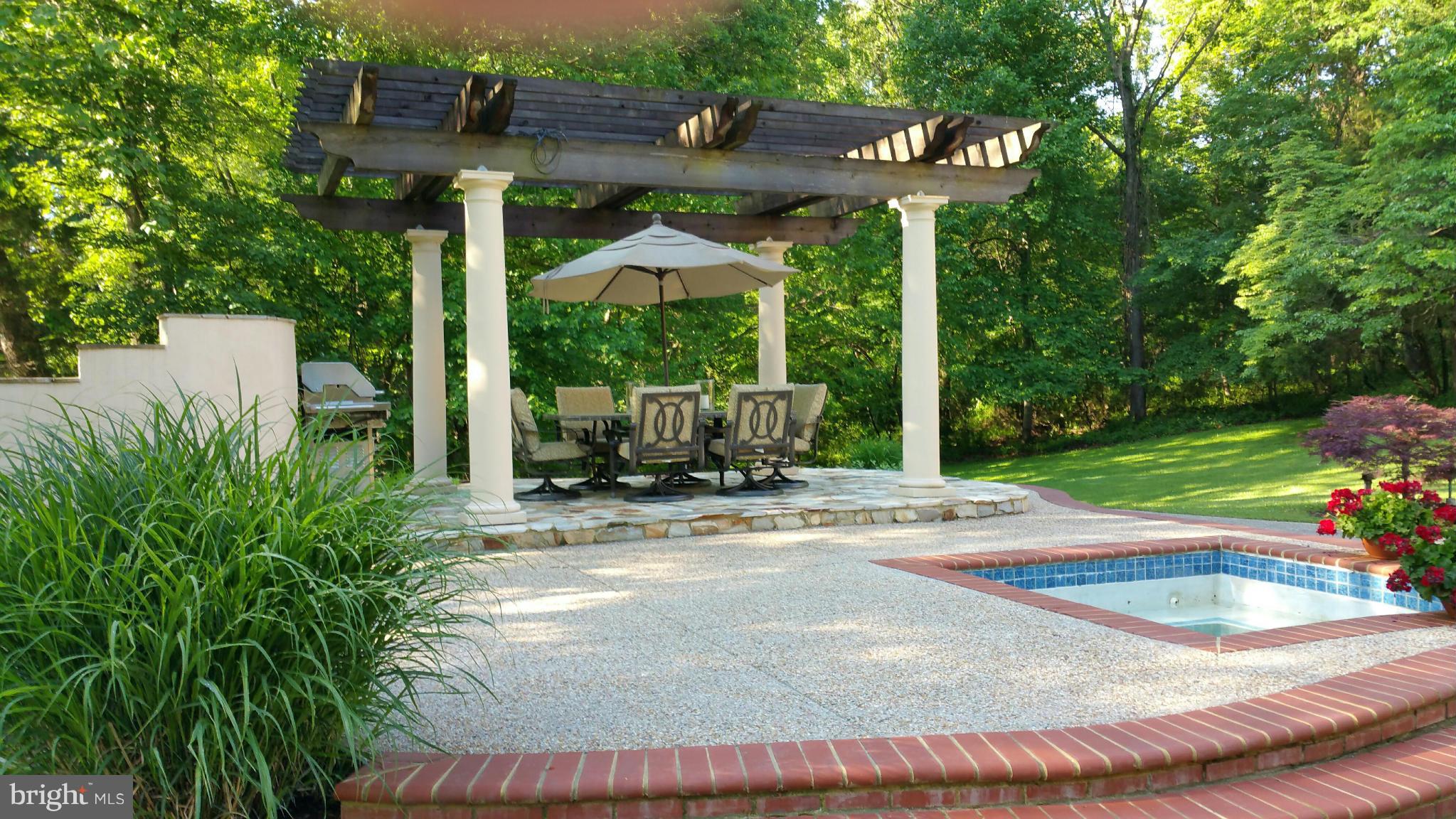 8823 Brook Road McLean, VA 22102 - Photo 26 of 30 a view of a house with backyard and sitting area