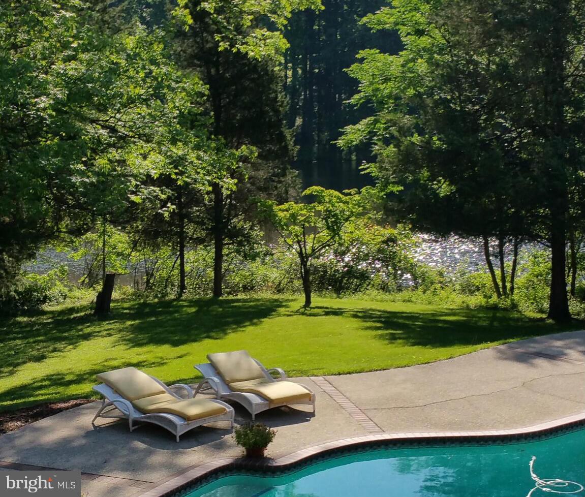 8823 Brook Road McLean, VA 22102 - Photo 29 of 30 a view of yard with swimming pool and green space