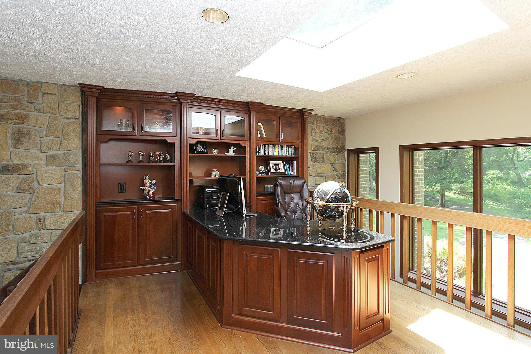 8823 Brook Road McLean, VA 22102 - Photo 4 of 30 a kitchen with stainless steel appliances granite countertop a stove and more cabinets
