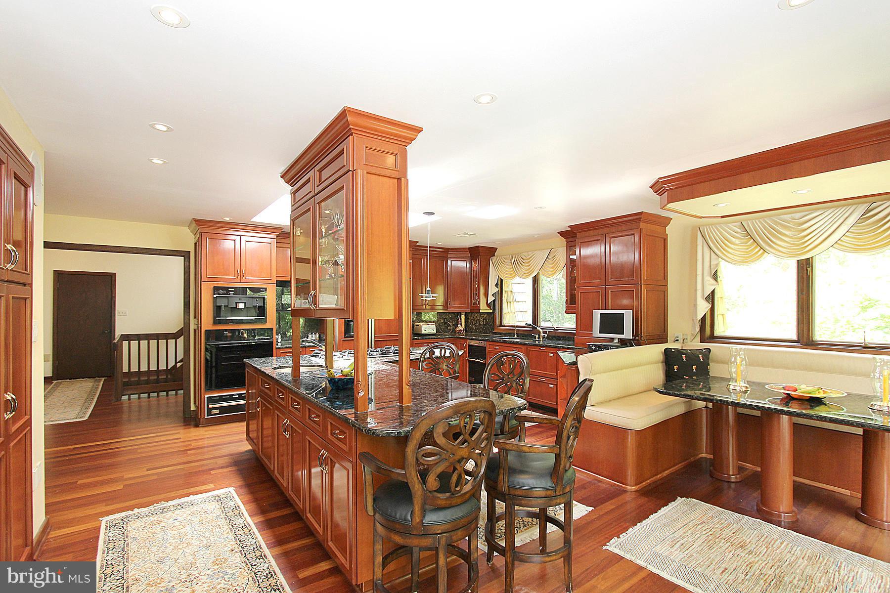 8823 Brook Road McLean, VA 22102 - Photo 8 of 30 a living room with dining table and a large window
