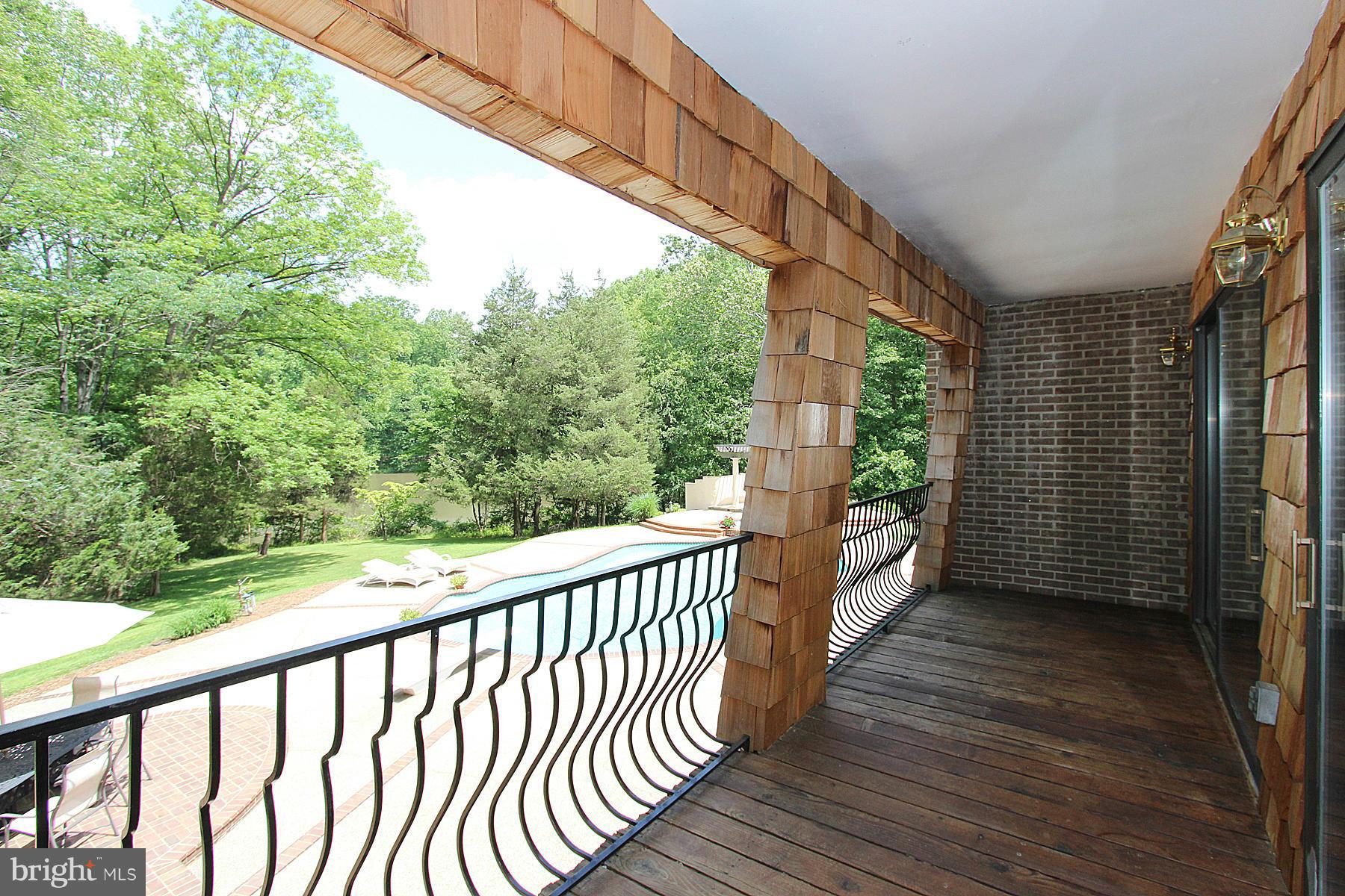 8823 Brook Road McLean, VA 22102 - Photo 9 of 30 a view of balcony with wooden floor