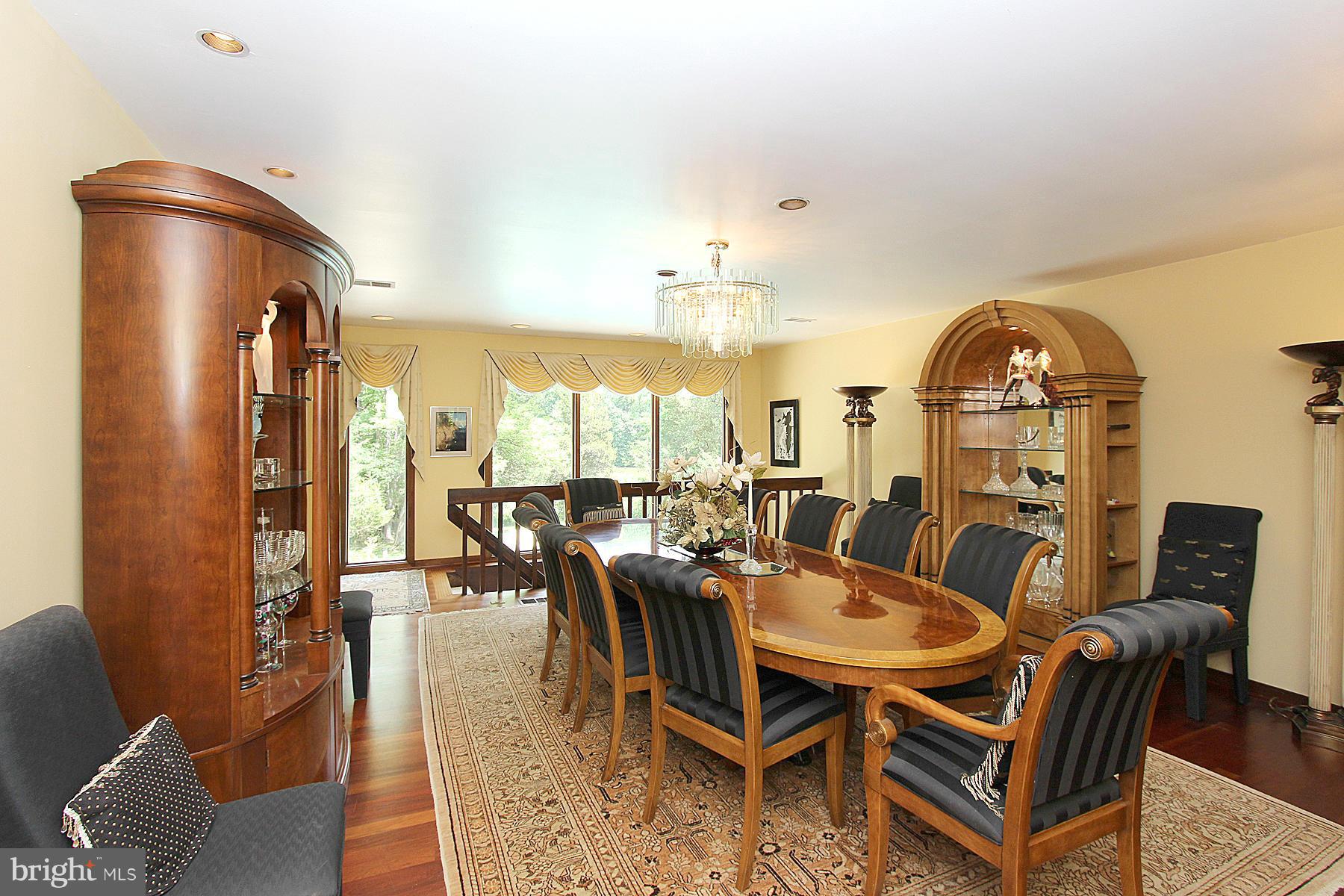 8823 Brook Road McLean, VA 22102 - Photo 10 of 30 a view of a dining room with furniture window and wooden floor