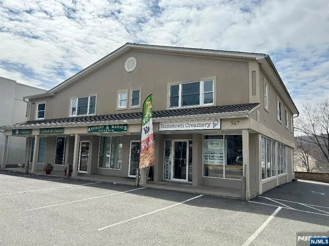 a front view of a house with a garage
