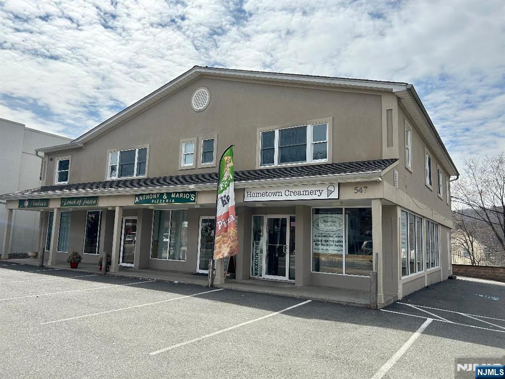 547 High Mountain Road, Unit 3 North Haledon, NJ 07508 - Photo 1 of 7 a front view of a house with a garage