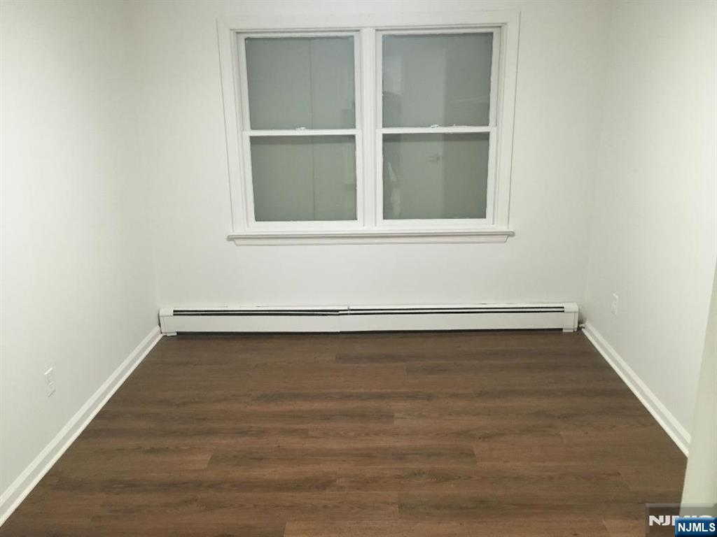 547 High Mountain Road, Unit 3 North Haledon, NJ 07508 - Photo 6 of 7 a view of a small space with wooden floor and a window