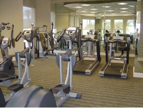 1065 Borghese Lane, Unit 704 Naples, FL 34114 - Photo 3 of 5 a room with lots of gym equipment