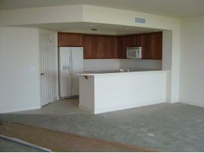 1065 Borghese Lane, Unit 704 Naples, FL 34114 - Photo 5 of 5 a kitchen with stainless steel appliances granite countertop a refrigerator and a stove