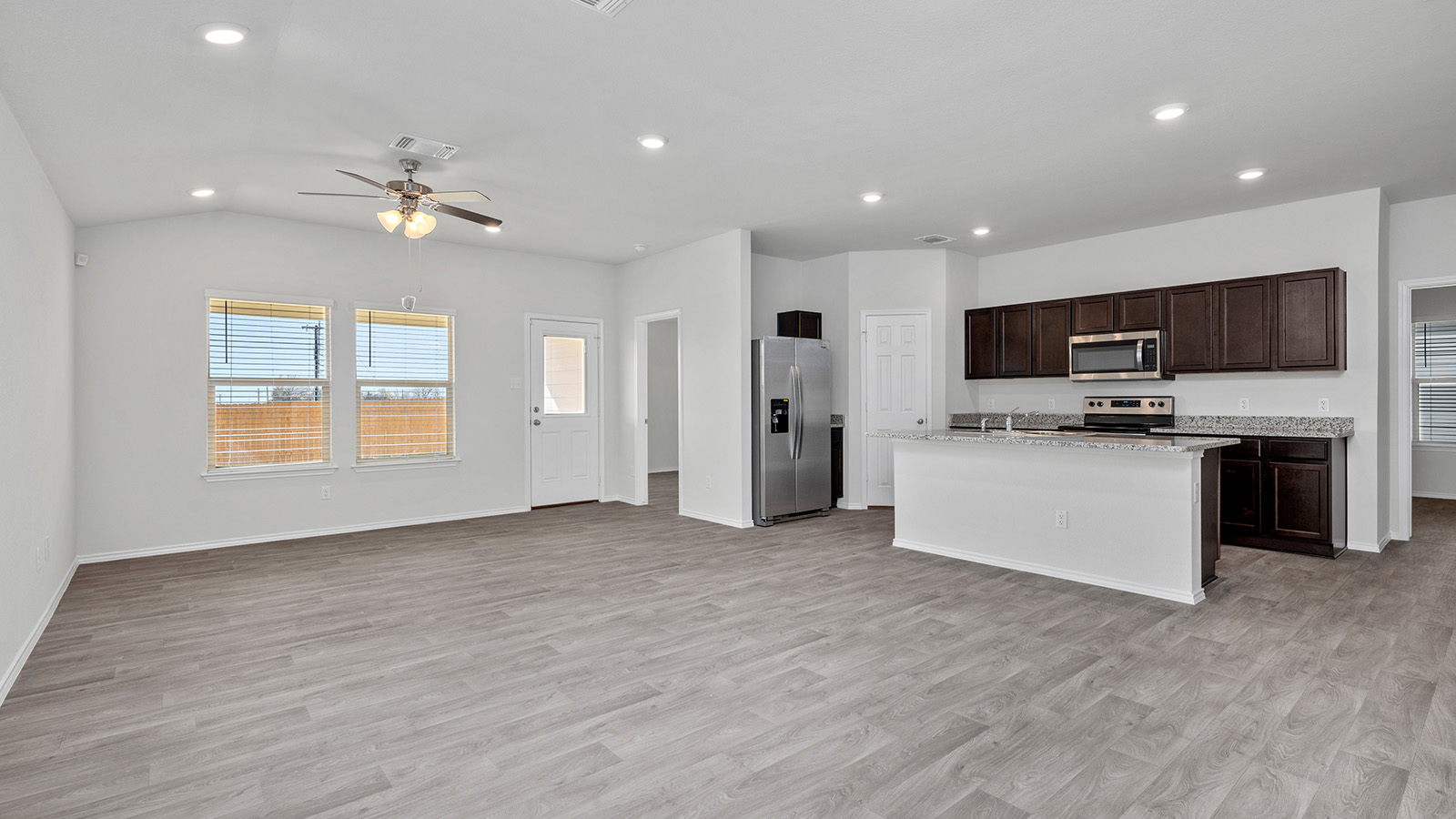 1316 Coriander Road Temple, TX 76501 - Photo 21 of 22 a view of kitchen with microwave a stove top oven and cabinets