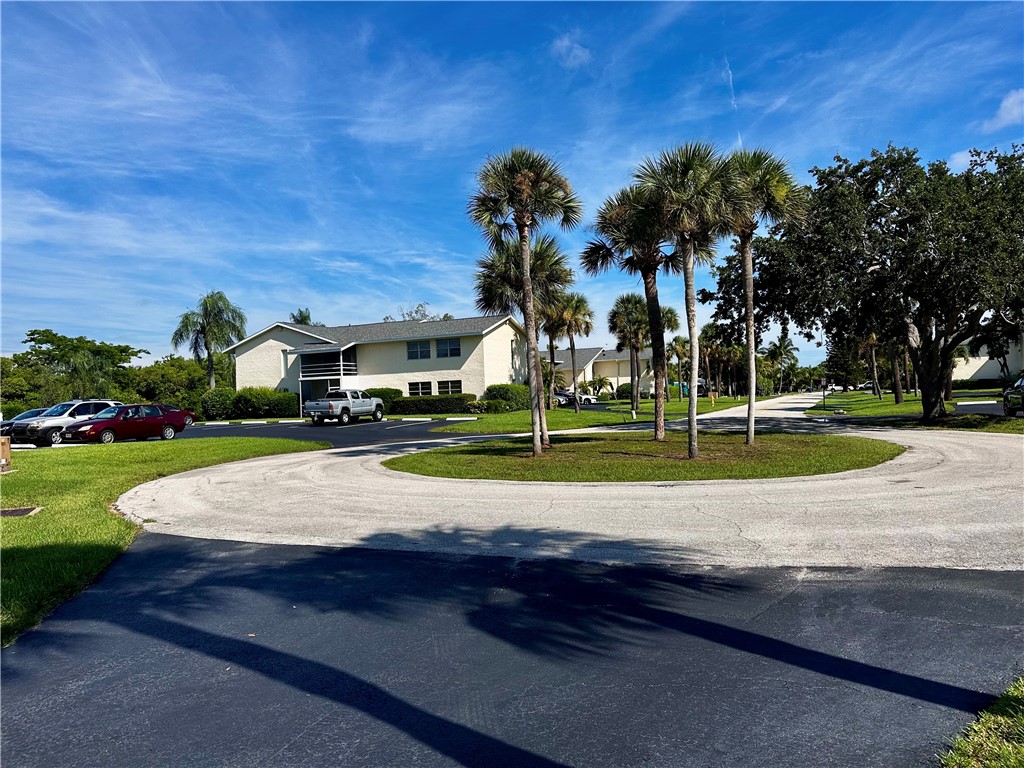 1815 Robalo Drive, Unit C201 Vero Beach, FL 32960 - Photo 26 of 31 a view of a playground with basketball court