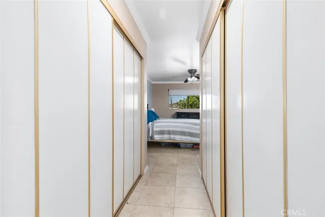 a bathroom with a granite countertop sink toilet a mirror and shower