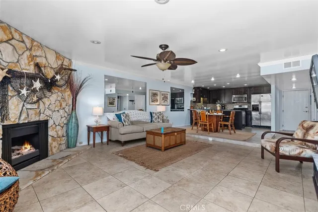 a living room with furniture and a fireplace