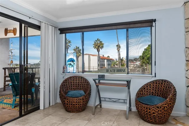 a room with wooden floor and outdoor seating