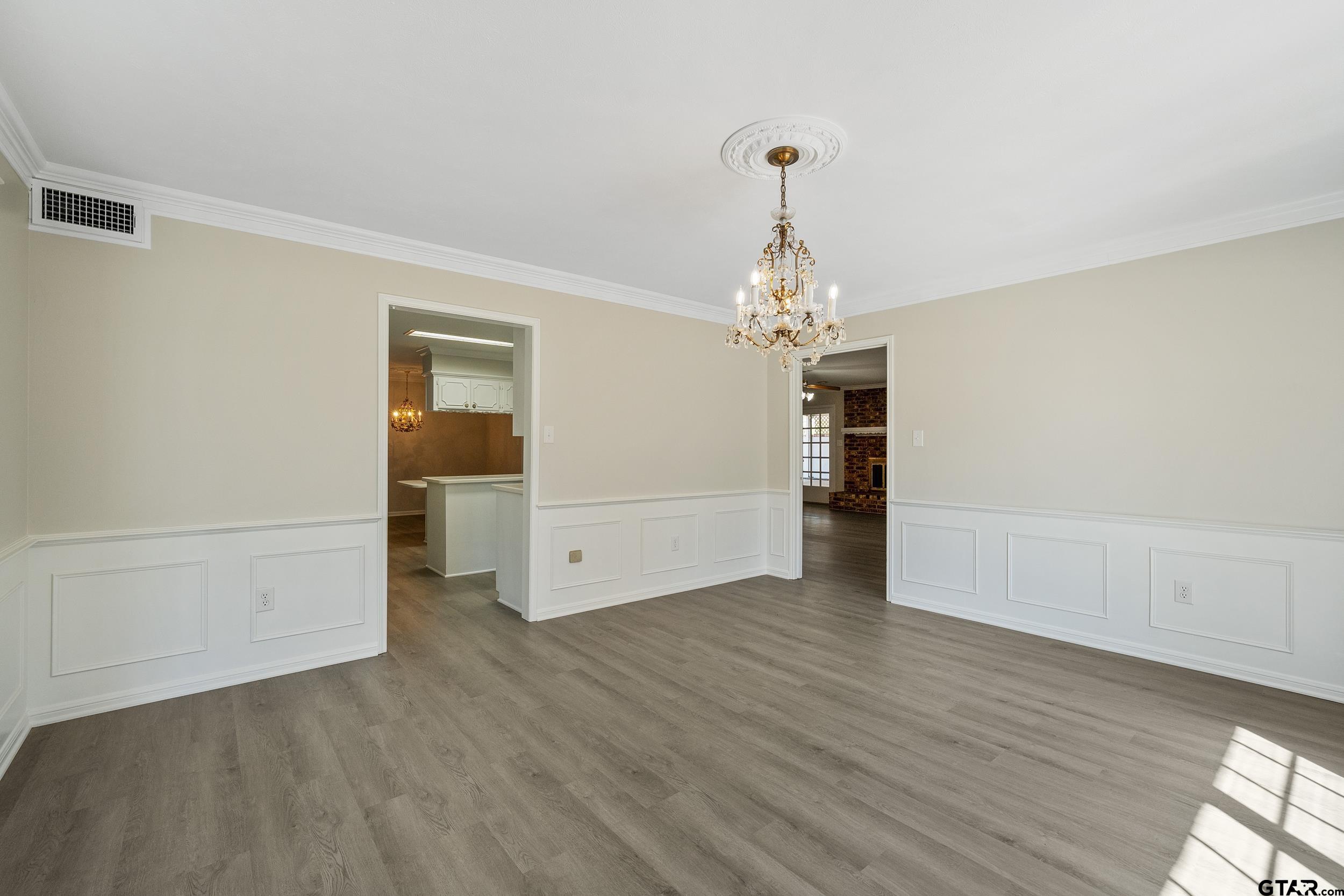 238 North Main Street Rusk, TX 75785 - Photo 15 of 42 wooden floor in an empty room with a window