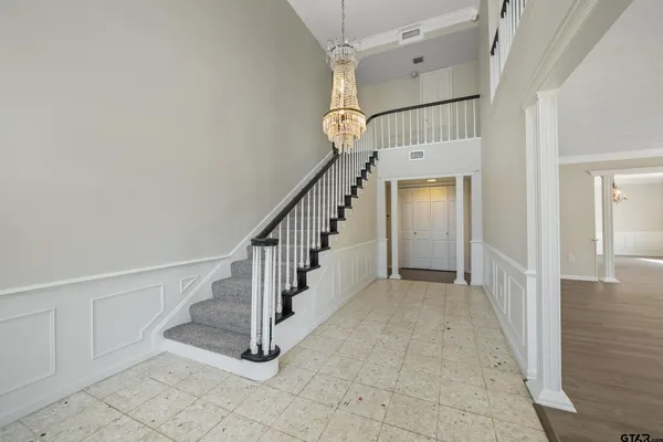 a view of a hallway with staircase
