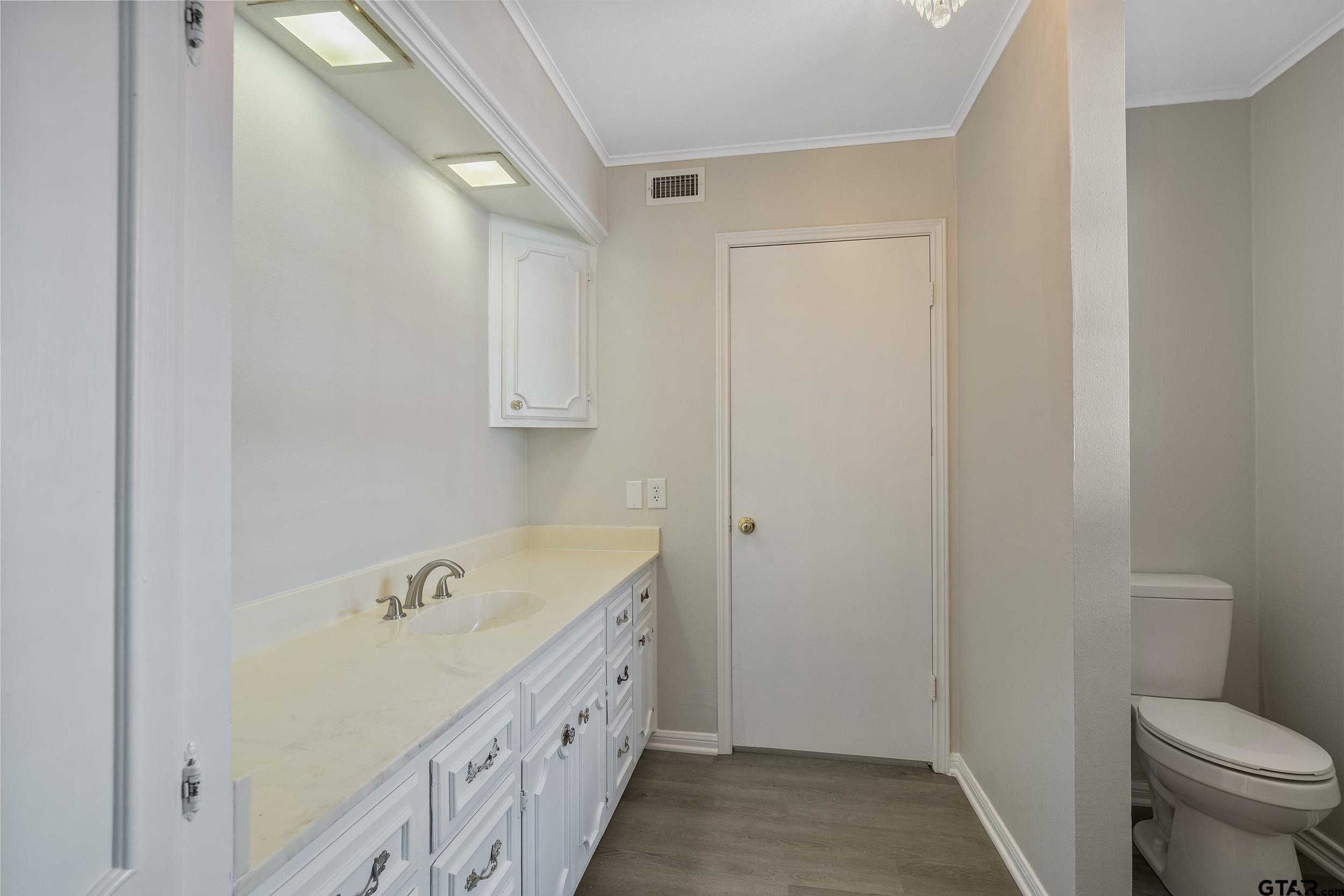 238 North Main Street Rusk, TX 75785 - Photo 29 of 42 a bathroom with a sink a toilet and shower