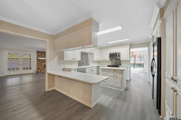 a kitchen with a stove and a microwave