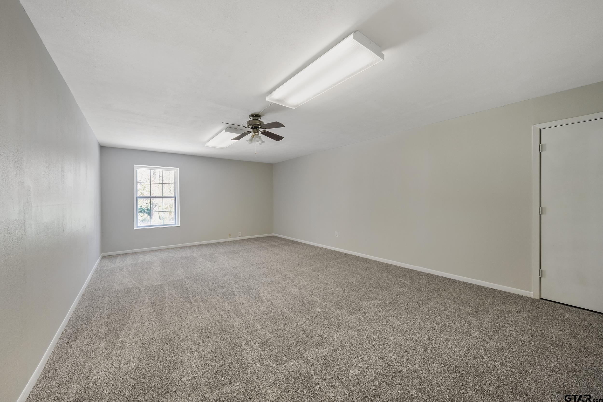 238 North Main Street Rusk, TX 75785 - Photo 4 of 42 a view of an empty room with a window