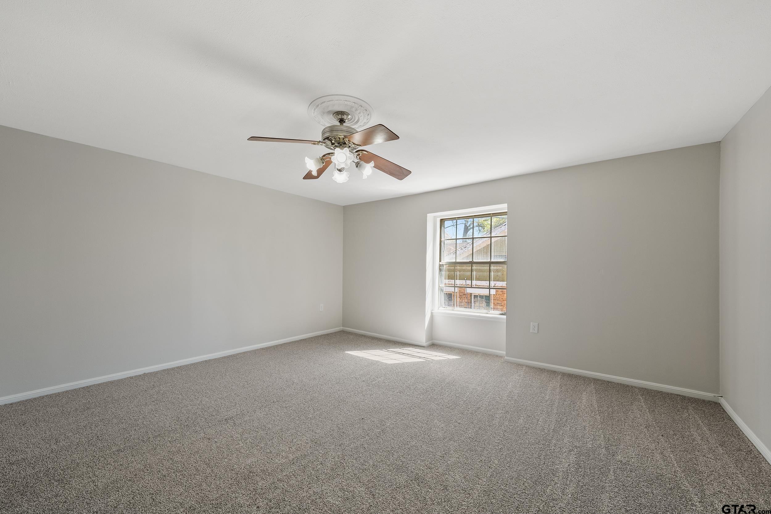 238 North Main Street Rusk, TX 75785 - Photo 5 of 42 a view of an empty room with a window