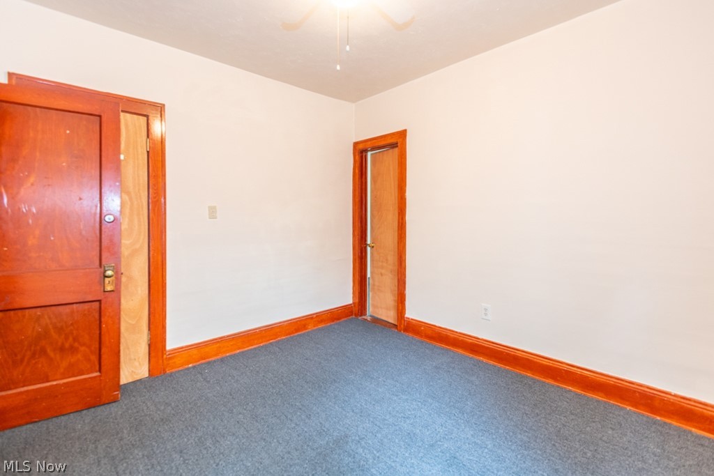 917 Helmsdale Road Cleveland Heights, OH 44112 - Photo 21 of 28 Carpeted empty room with baseboards and a ceiling fan