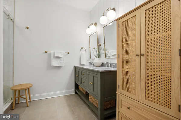 a bathroom with a sink a vanity and a mirror