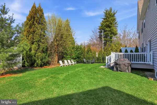 a view of a chair and table in the garden