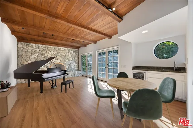 a kitchen with stainless steel appliances granite countertop a sink and a stove