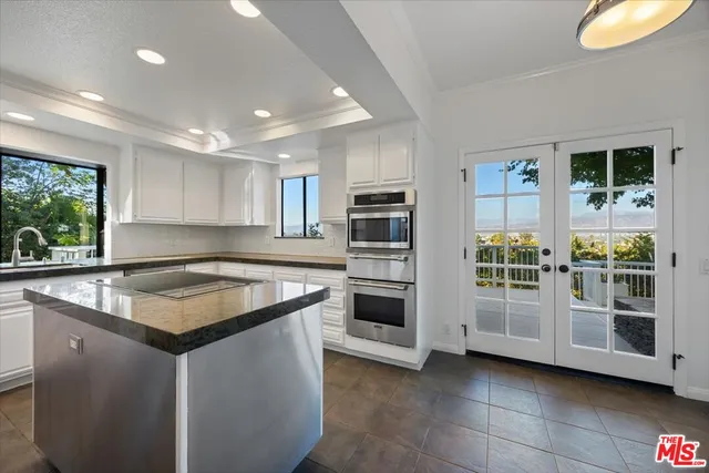 a room with walk in closet and wooden floor