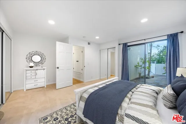 a view of a balcony with wooden floor