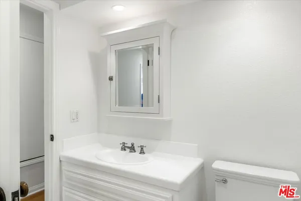 a utility room with cabinets washer and dryer