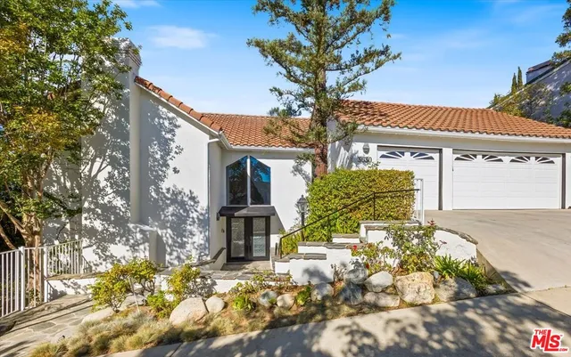a view of a entryway with stairs and wooden floor